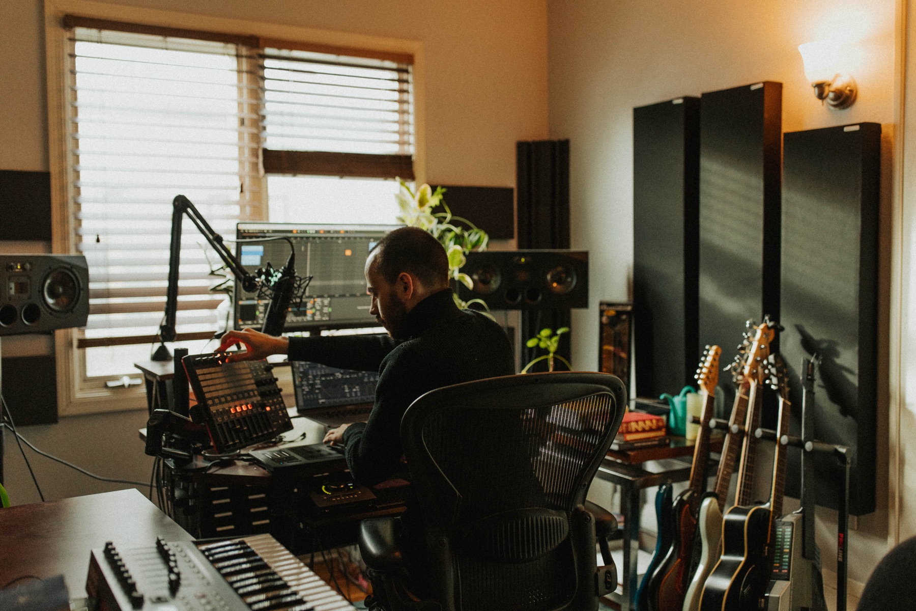 Audio engineer working at the mixing console in the Digital Nap Media home studio